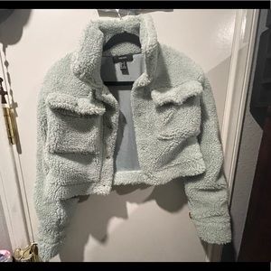 By blue fuzzy jacket